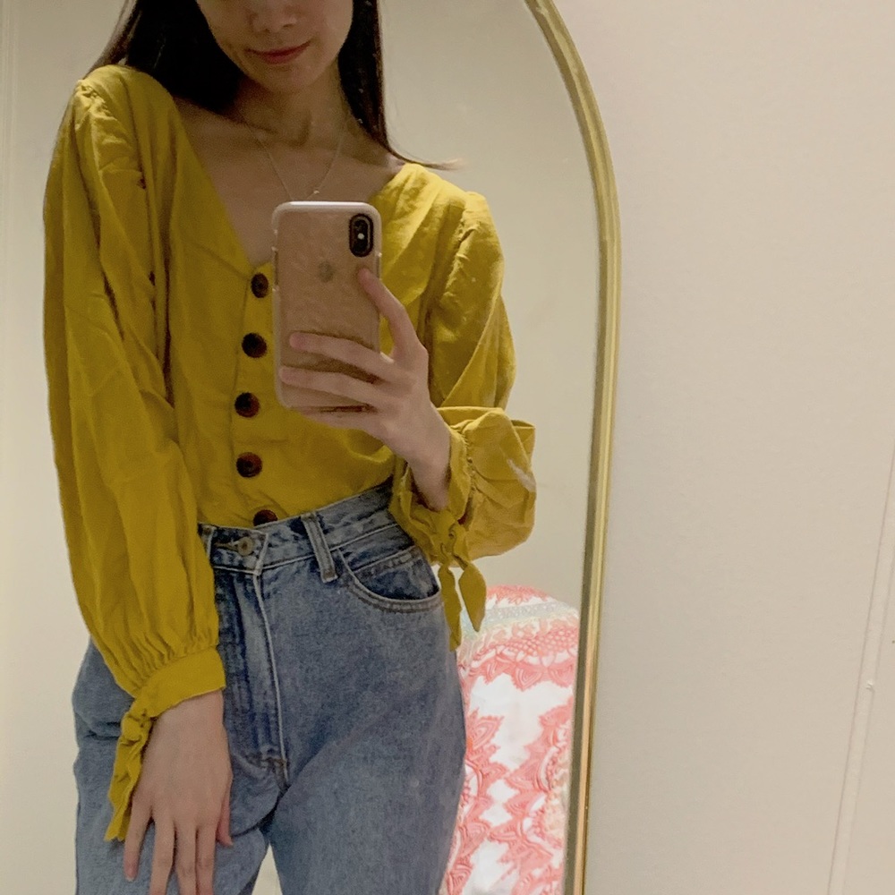 yellow buttoned blouse
